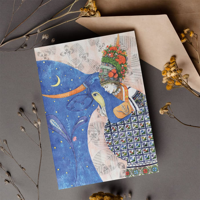 A folk-illustrated card in blue and gold
